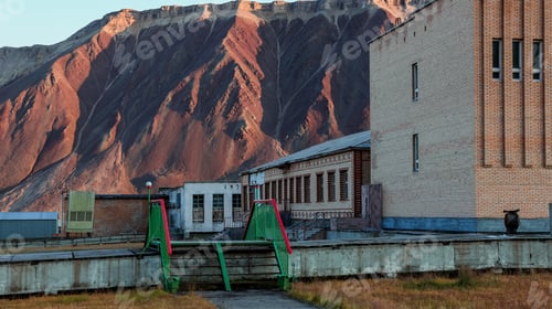 Preview: Exploring the abandoned buildings of Pyramiden in Svalbard under the mountains at sunset