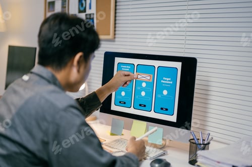 Preview: Ui developer is working on a user interface for a mobile application, using a wireframe kit displaye