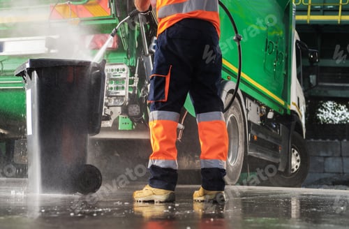 Preview: Garbage Truck Operator Pressure Washing Black Trash Can
