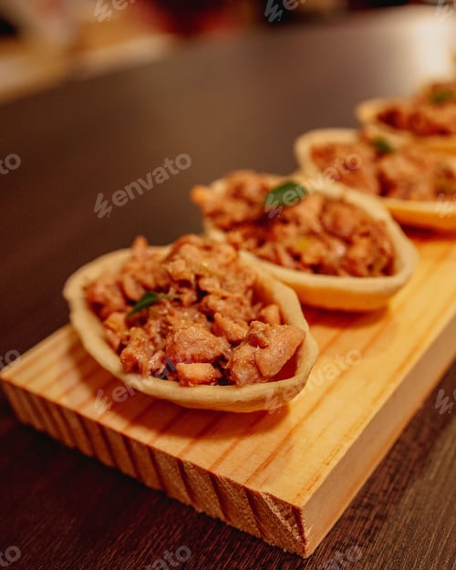 Preview: Vibrant closeup of a delicious appetizer, arranged on a wooden board