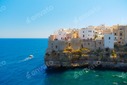 Preview: Polignano a Mare, Italy. Panoramic view of the city. Old buildings on a cliff by the sea.