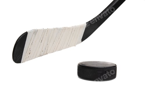 Preview: Closeup of a hockey stick and puck on a white background