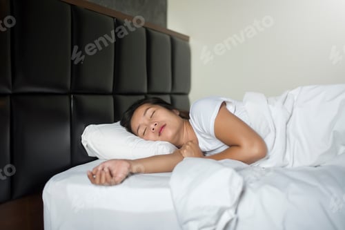 Preview: Asian young woman sleeping lying in bed