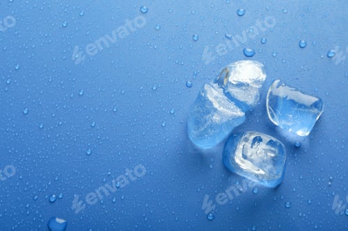 Preview: Ice forms on wet blue background, space for text