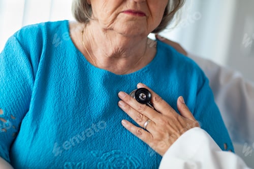 Preview: Female Doctor Checking The Heart With Stethoscope of Senior Adult Woman