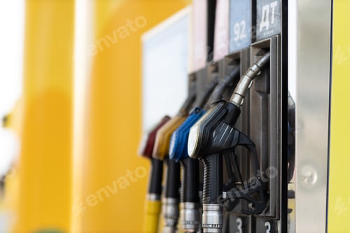 Preview: Filling pistol in his hand at gas station