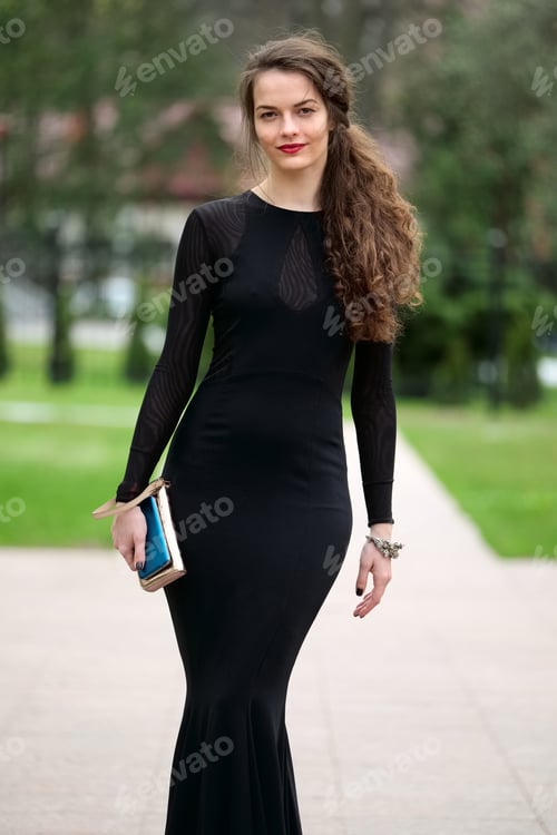 Preview: Gorgeous lady in black fitted dress approaching to entrance