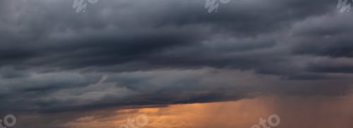 Preview: Cloudscape during a dark, rainy and colorful morning sunrise