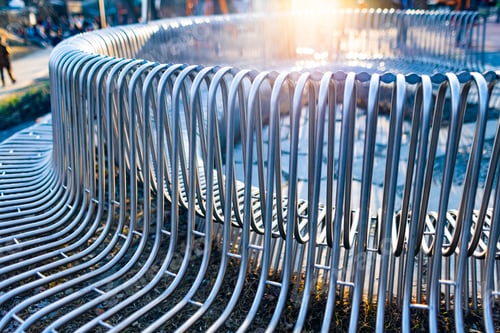 Preview: Close-up street bench metal pipes arranged parallel