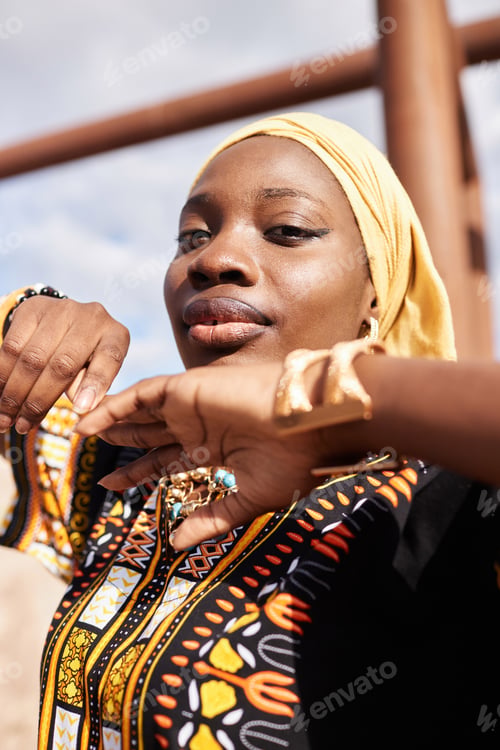 Preview: African American Girl in Traditional Dress and Dancing in Desert Sunlight