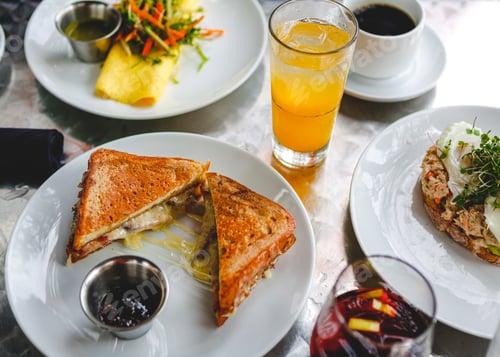 Preview: Brunch spread on a silver table with cocktails and coffee