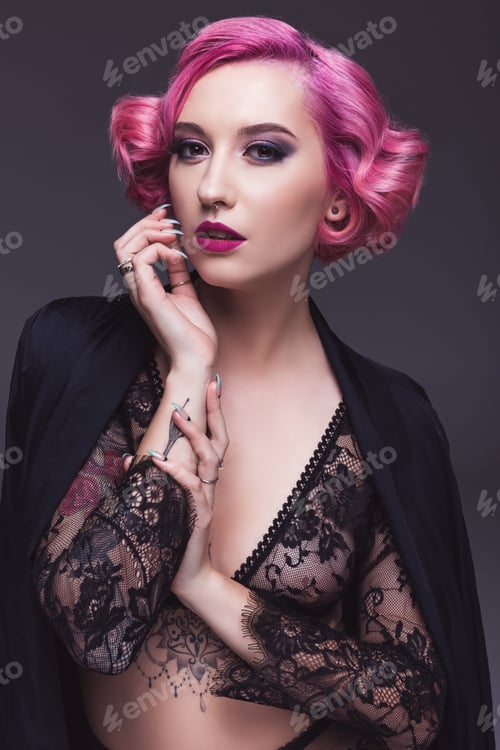 Preview: seductive tattoed pin up girl in transparent lingerie infront of grey background