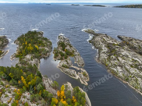 Preview: Aerial view of autumn forest, rocky islands, and open sea