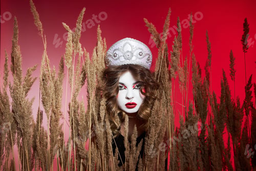 Preview: Fashion Russian woman in a kokoshnik with samovar on red background, bright makeup, make-up on woman