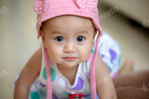 Preview: Close up on baby’s face look at camera