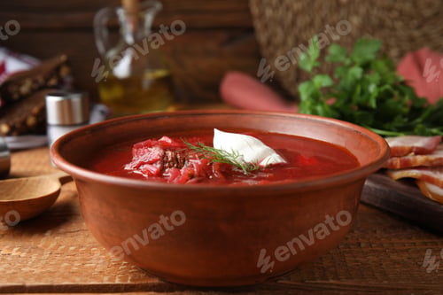 Preview: Clay bowl with Ukrainian borsch served on wooden table