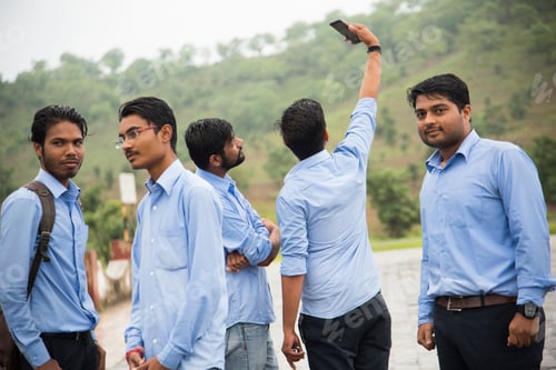 Preview: Young Indian People taking a selfie with Smartphone at outdoors.
