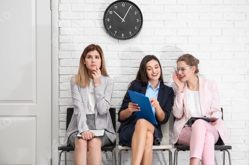 Preview: Young women waiting for job interview, indoors