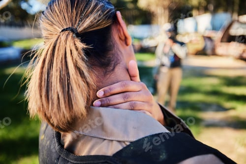 Preview: Closeup, neck pain and hand of woman with injury in paintball, sports and training on blurred backg