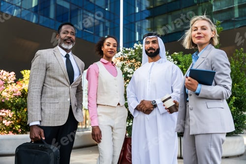 Preview: Group of multiethnic business people meeting an emirati businessman