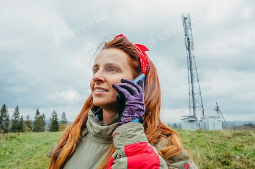 Preview: Mobile Tower. Woman Talking On A Cell Phone Near A Mobile Communications Tower.