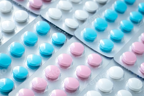 Preview: Texture of colorful tablets in blisters, heap of pills. Treatment concept from illness