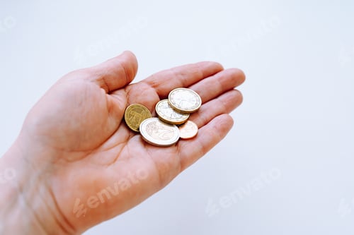 Preview: Female hand with euro coins