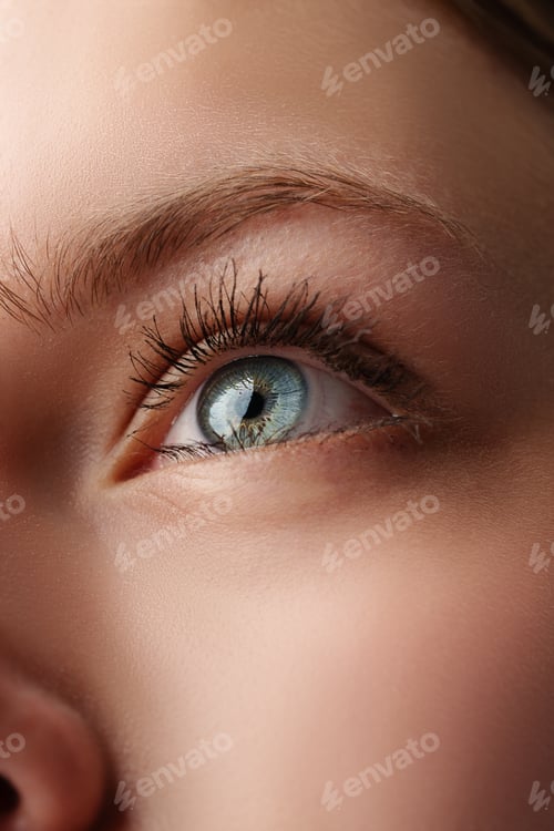 Preview: Close up of young female blue eye