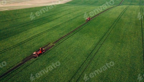 Preview: Aerial view of beet harvesters on the green agricultural field