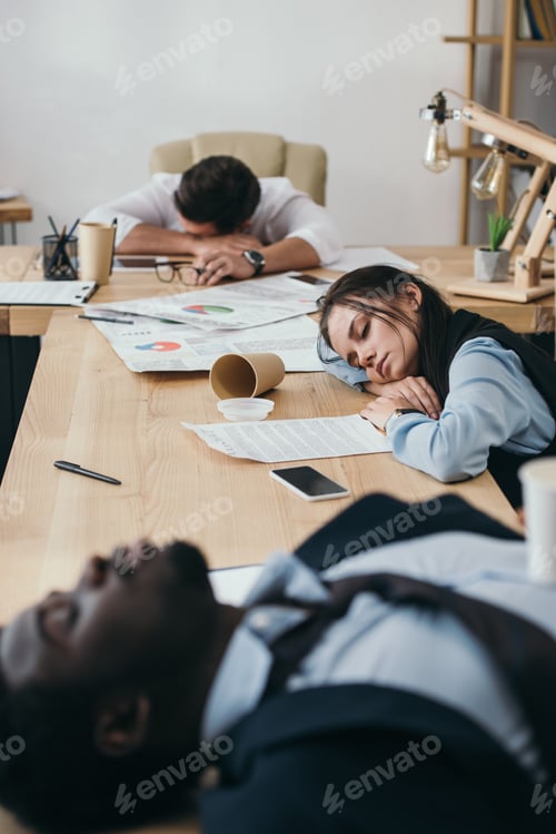 Preview: group of businesspeople sleeping in conference hall at office