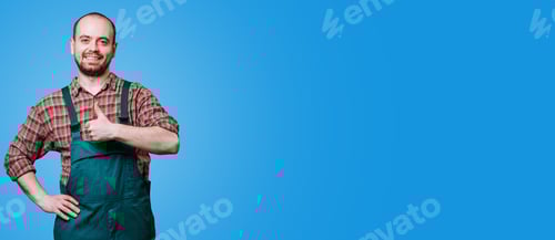 Preview: Smiling man wearing overalls gives a thumbs up