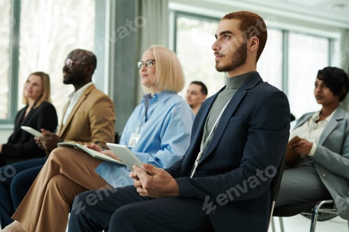 Preview: Professionals Attending Business Conference in Modern Workplace