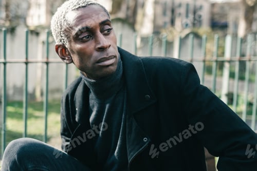 Preview: Trendy African American man in park