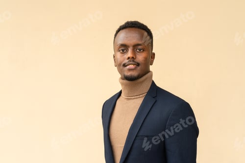 Preview: Portrait of young handsome black businessman smiling