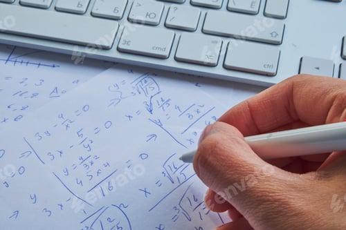 Preview: sheet of paper filled with calculations as a background.