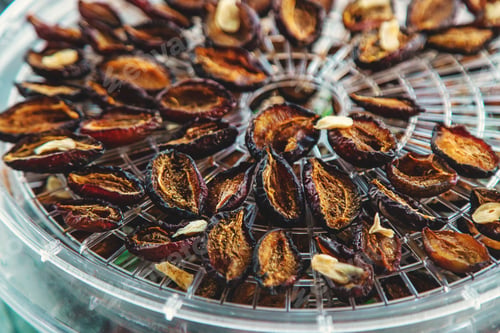 Preview: Plums dried in a dehydrator. Selective focus.