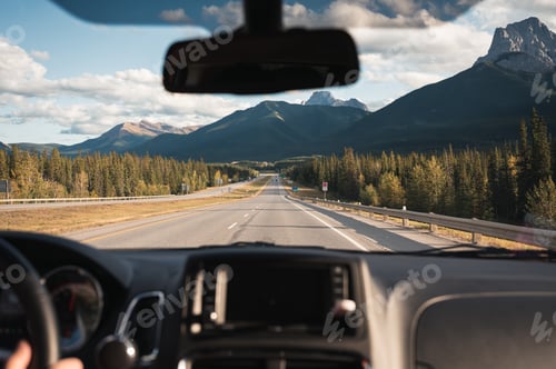 Preview: Road trip with car driving with rocky mountains on highway in Banff national park