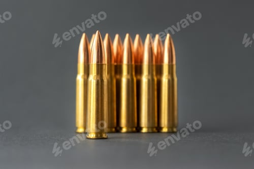 Preview: Bullets on gray background. Cartridges 7.62 caliber for Kalashnikov assault rifle