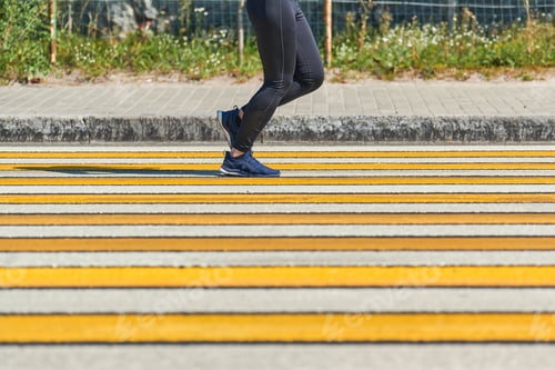 Preview: Woman running crosswalk, copy space