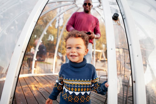 Preview: Father Walking Outdoors with Young Son, Caring for Him and Watching Over