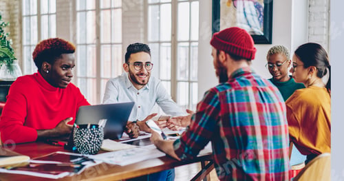 Preview: Group of skilled employees working at desktop