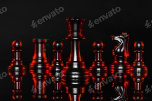 Preview: Chess pieces on dark background with red backlight close up