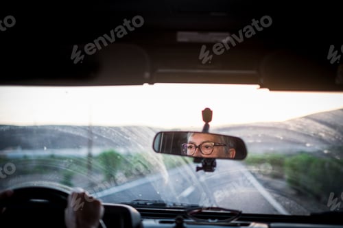 Preview: Adult senior woman driving a car looking at the road
