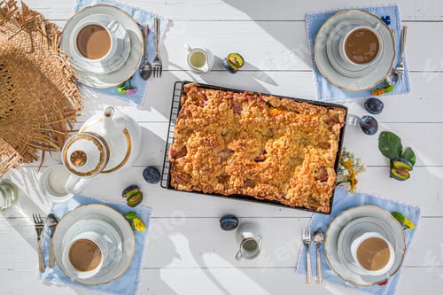 Preview: Top view of plum pie and coffee in summer