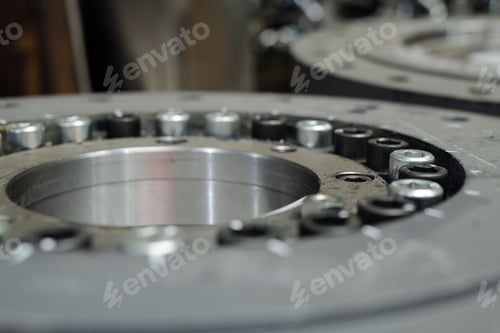 Preview: Macro shot of huge round detail or spare part made up of stainless steel