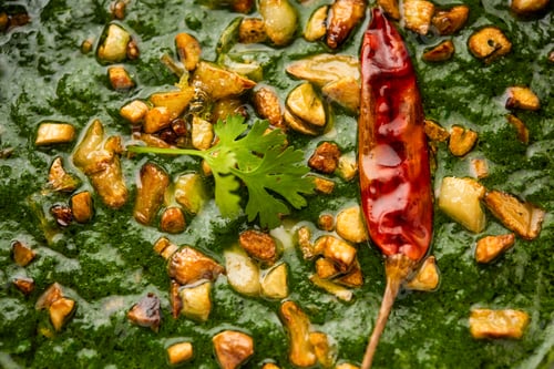 Preview: lasooni palak recipe or dhaba style garlic spinach curry, Indian main course served with naan