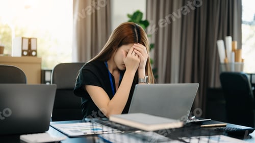 Preview: Asian business woman is stressed, bored, and overthinking from working on a tablet