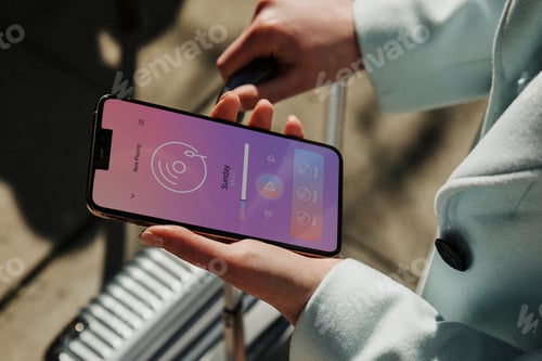 Preview: Traveler listening to music on a smartphone