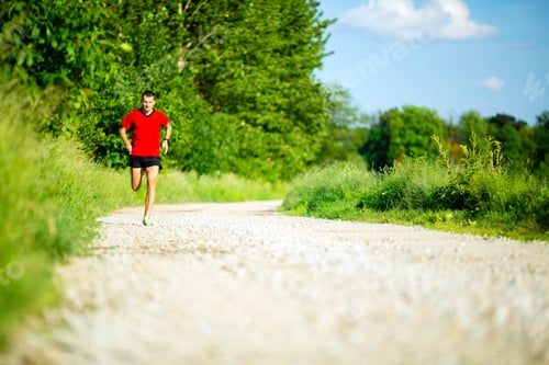 Preview: Man running jogging on country road