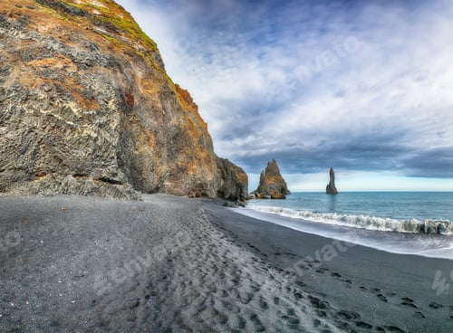 Preview: Breathtaking view of rock formations Troll Toes on Black beach Reynisfjara near the village of Vik.